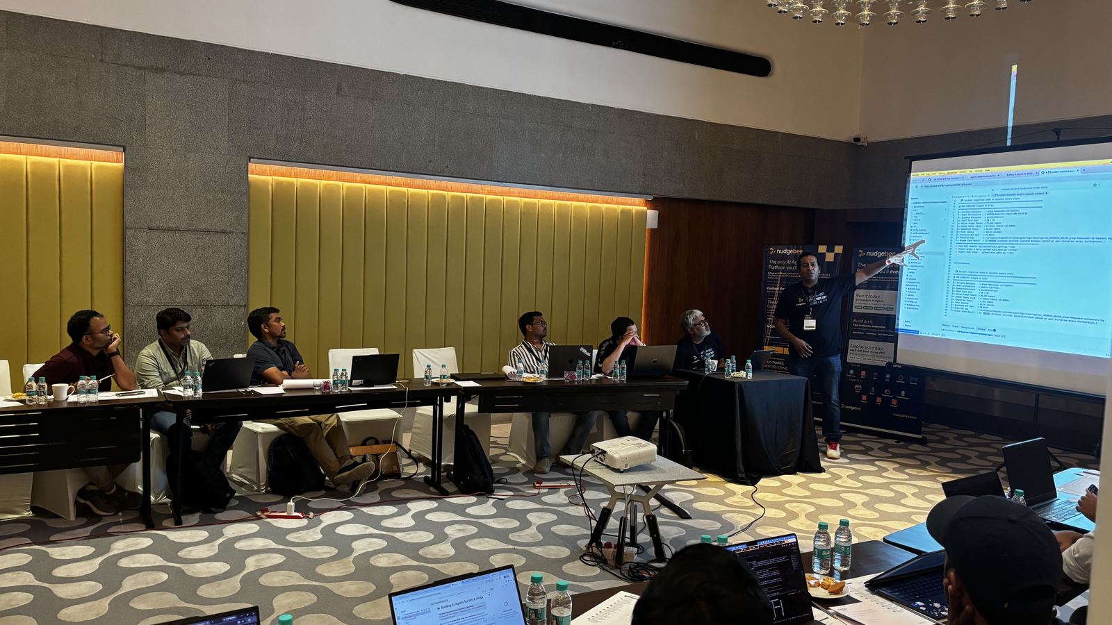A host walking the room through the session in Hyderabad